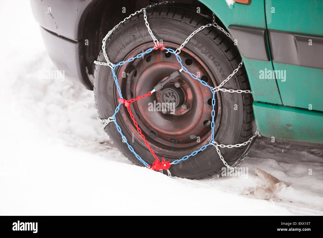 A car with snow chains Stock Photo Alamy