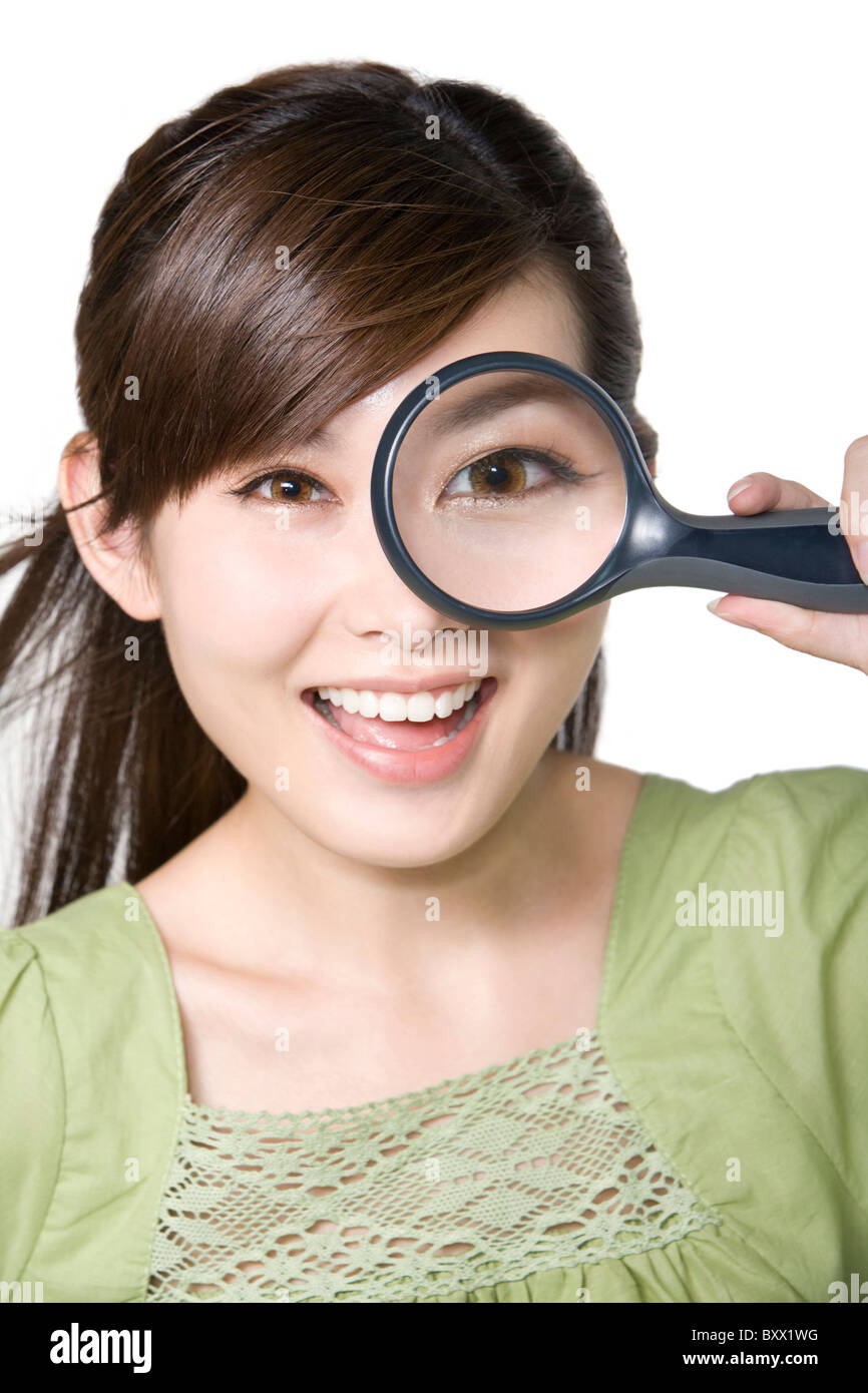 Young Woman Looking Through Magnifying Glass Stock Photo   Image Of