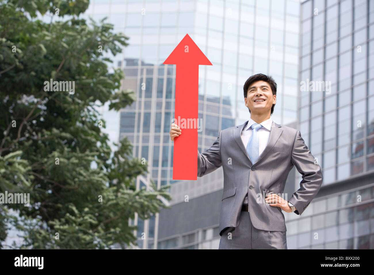 Chinese businessman with a red arrow Stock Photo - Alamy