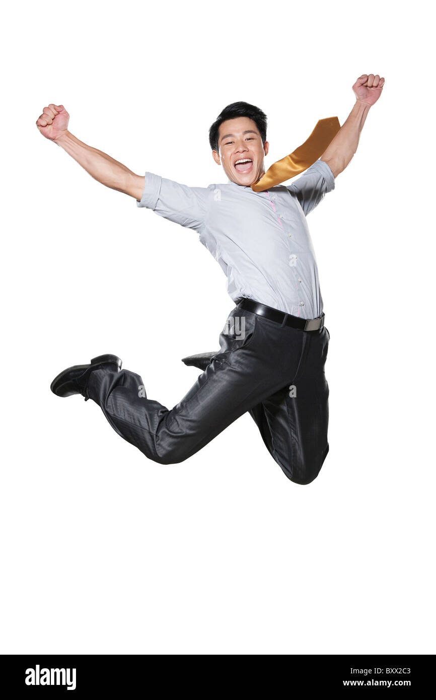 Businessman jumping in the air in celebration Stock Photo ...