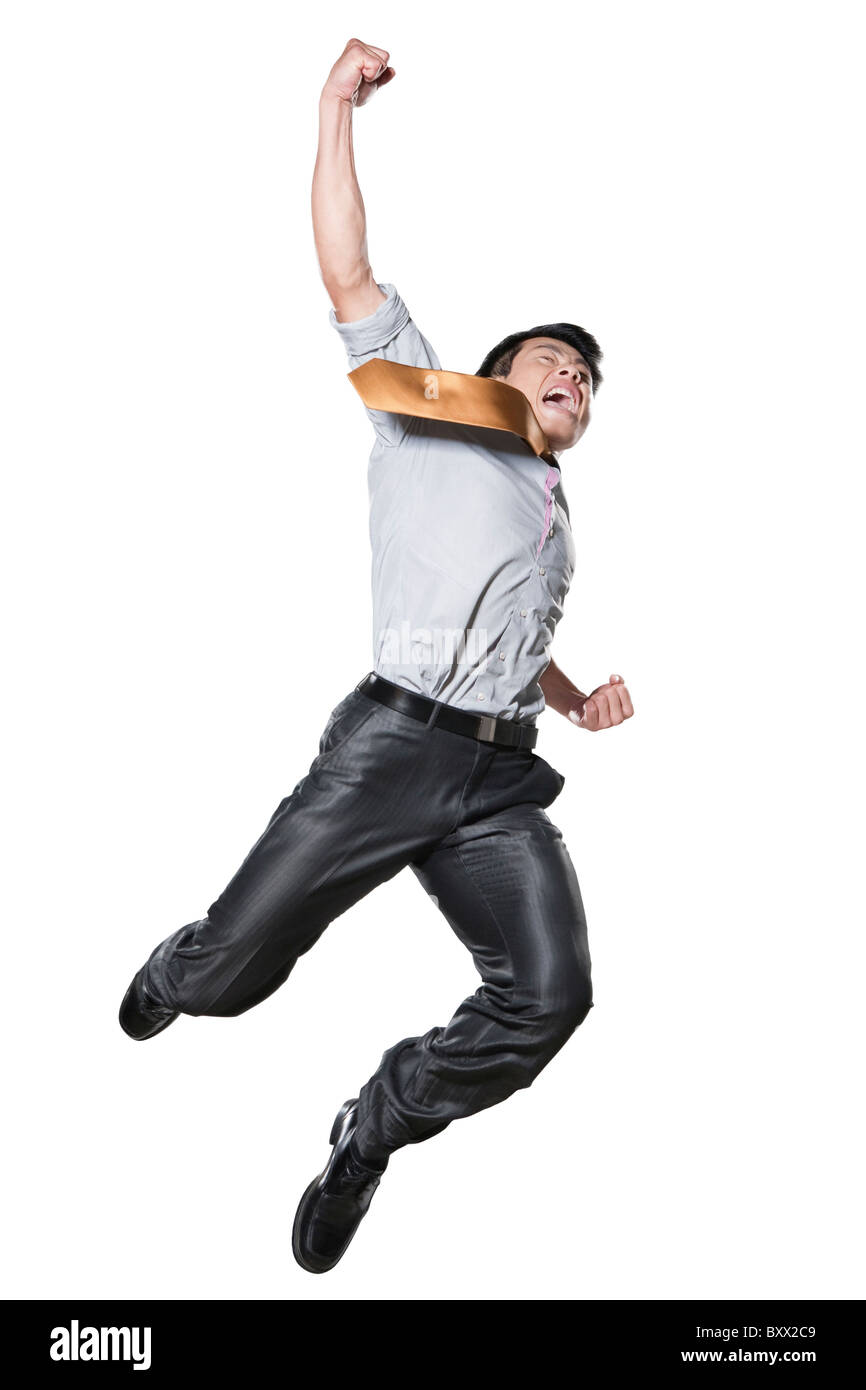 Businessman in martial arts position midair Stock Photo Alamy