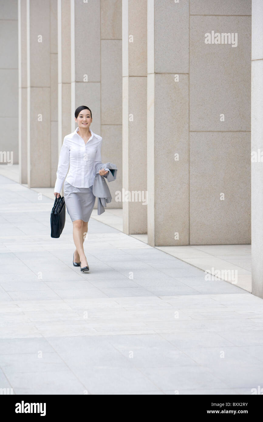 Woman long skirt walking away hi-res stock photography and images - Alamy