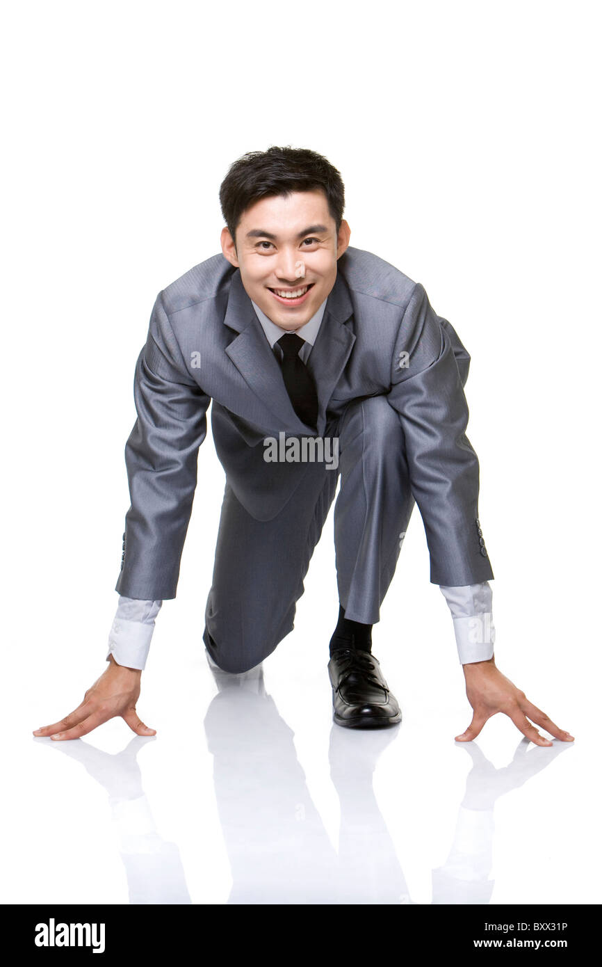 Business man in suit kneeling hi-res stock photography and images - Alamy