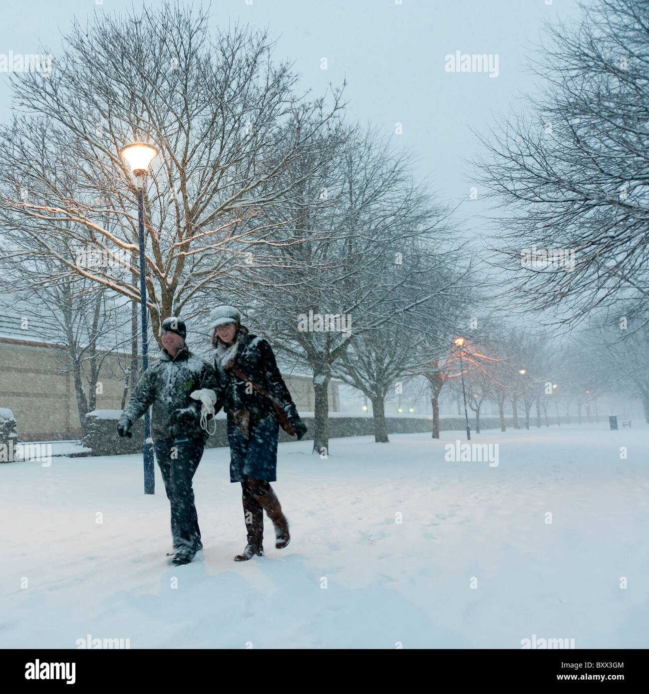 Early morning, people walking in the snow, Aberystwyth Wales UK December 2010 Stock Photo