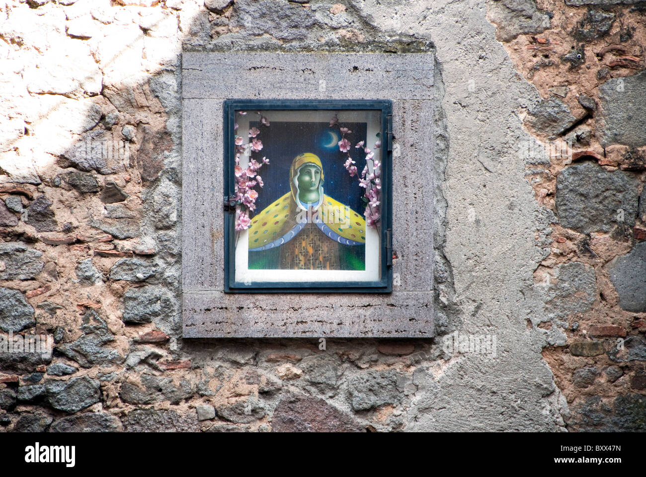 Wall shrine of the Madonna in the hill town of Piancastagnaio on the slopes of Mount Amiata, Tuscany Italy Stock Photo