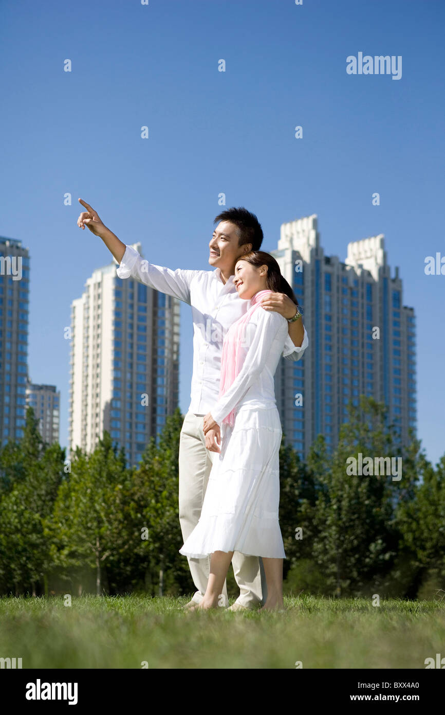 Couple taking a walk in the park Stock Photo - Alamy