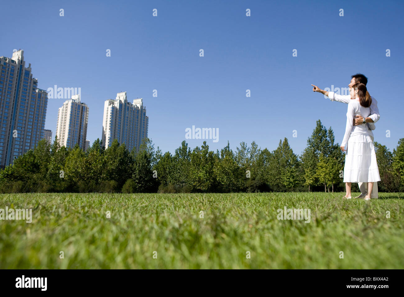 Couple taking a walk in the park Stock Photo - Alamy