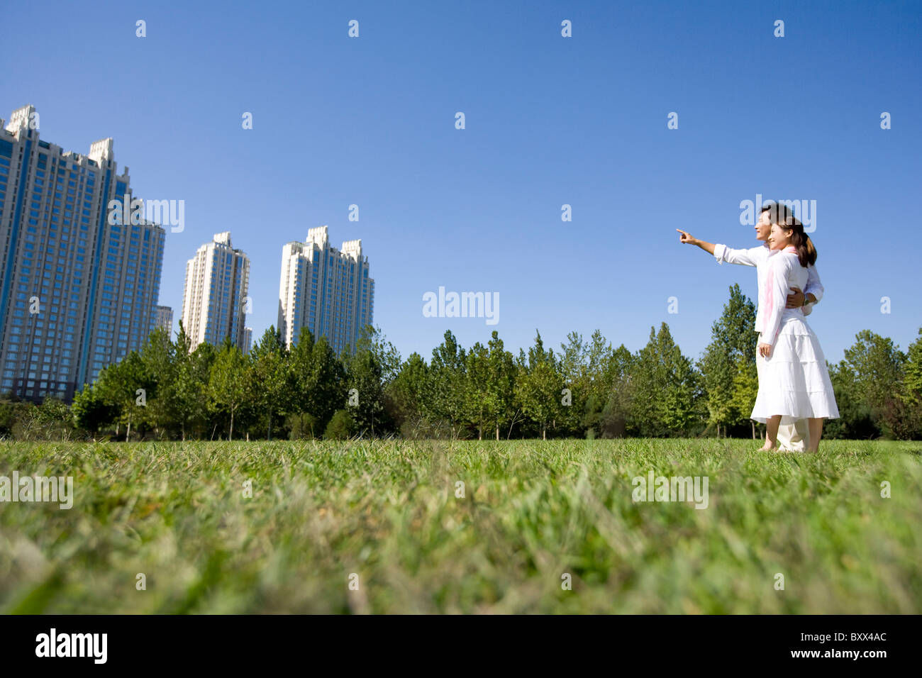 Couple taking a walk in the park Stock Photo - Alamy