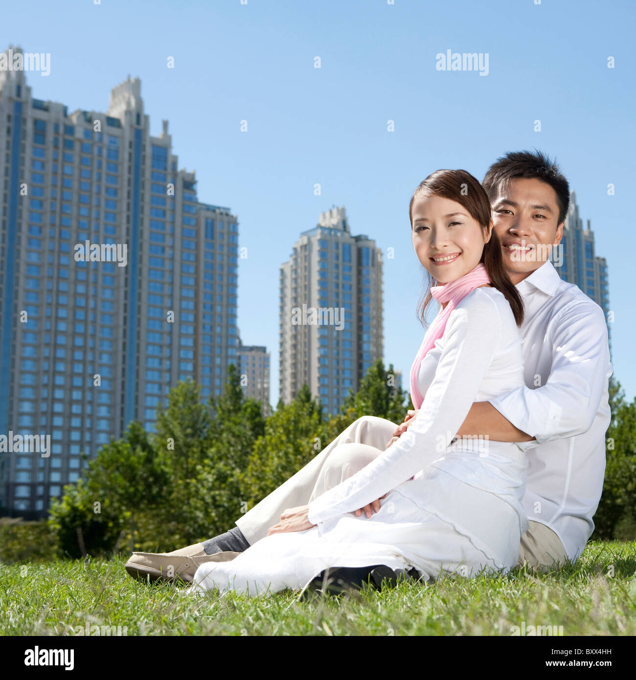 Young couple enjoying the park Stock Photo - Alamy