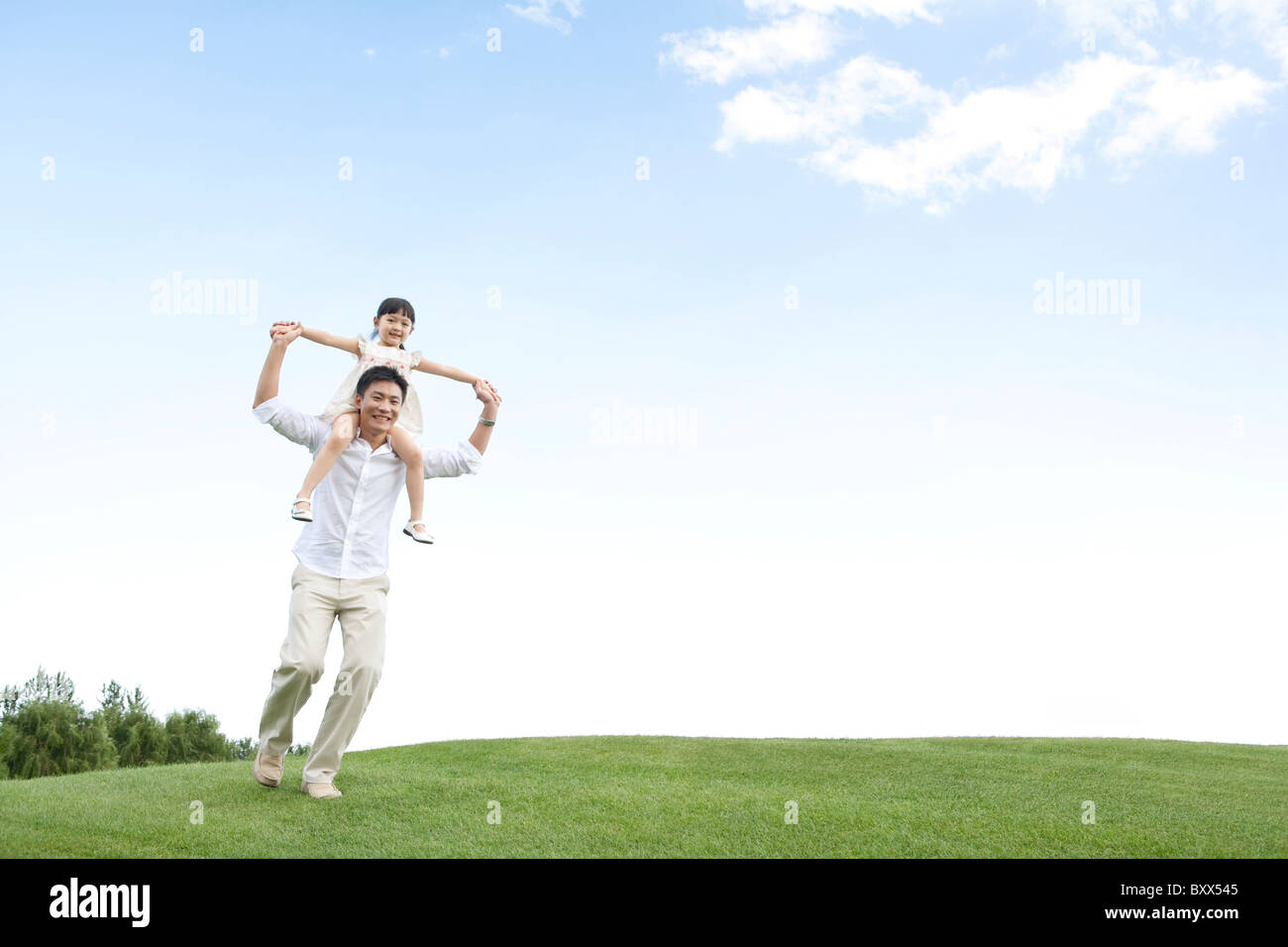 Father and daughter playing in the park Stock Photo - Alamy