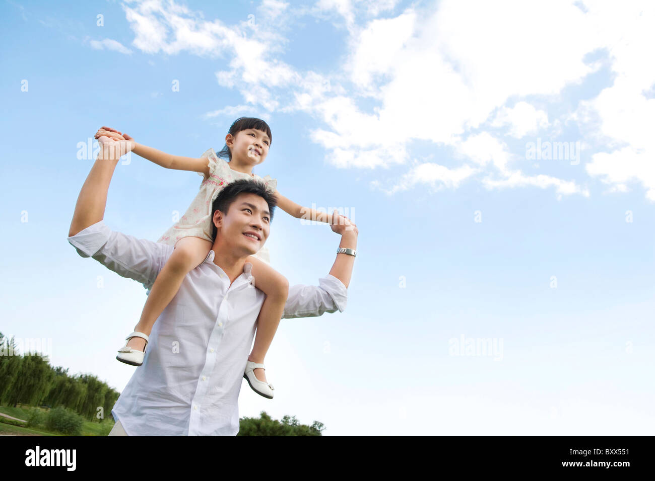 Father and daughter playing in the park Stock Photo - Alamy