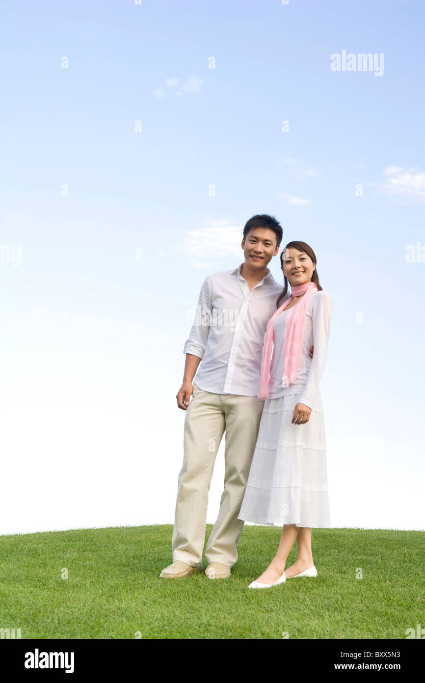 Young couple enjoying the park Stock Photo - Alamy
