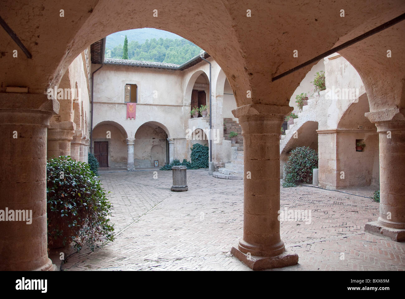 Courtyard of the Abbey of San Pietro in Valle, a former Umbrian monastery and now a luxury hotel Stock Photo