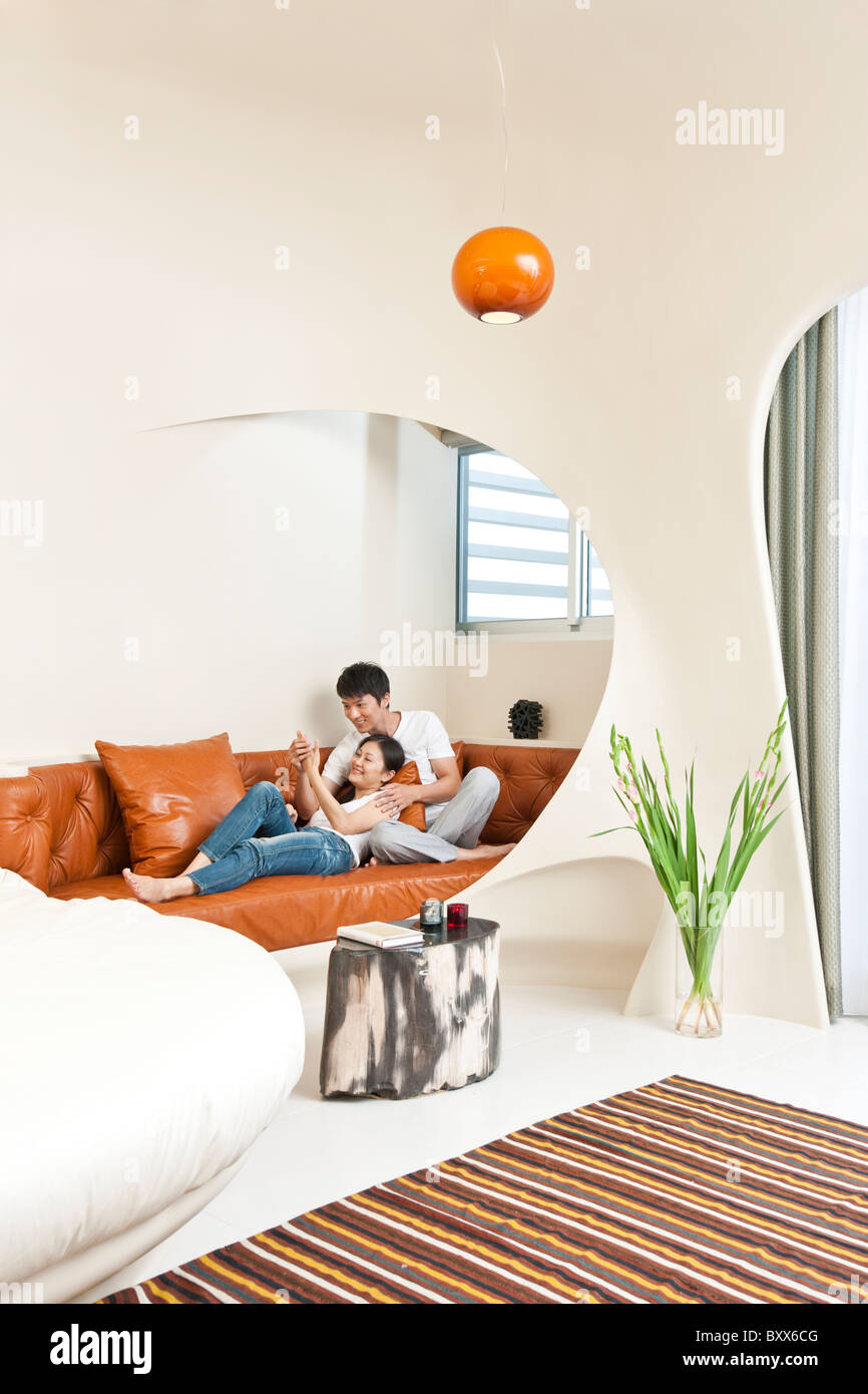 Man reclining in living room hi-res stock photography and images - Alamy