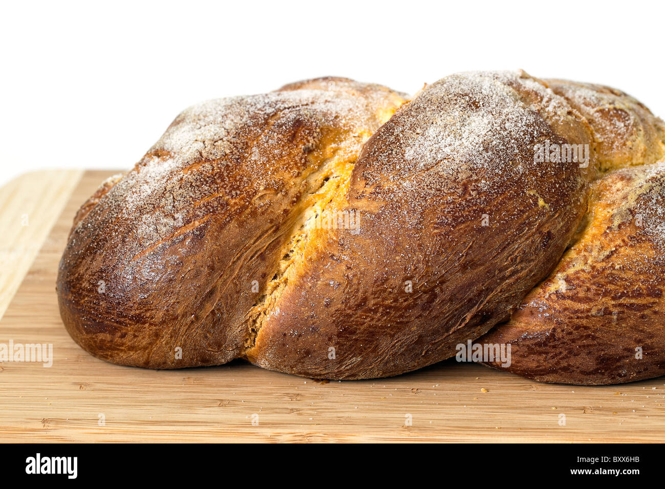 Homemade bread on a bamboo cutting board. Stock Photo