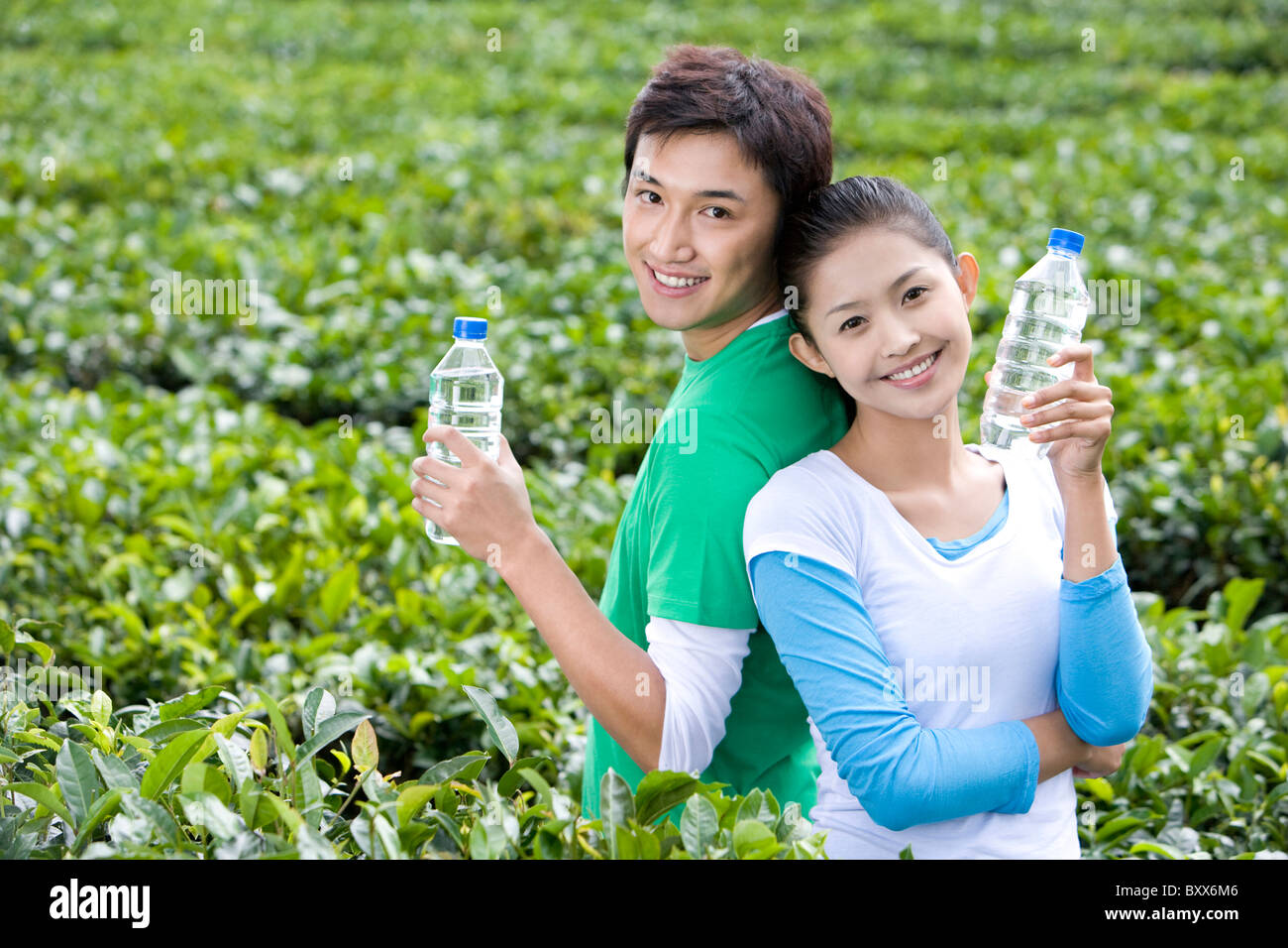 Two men holding up bottles hi-res stock photography and images - Alamy