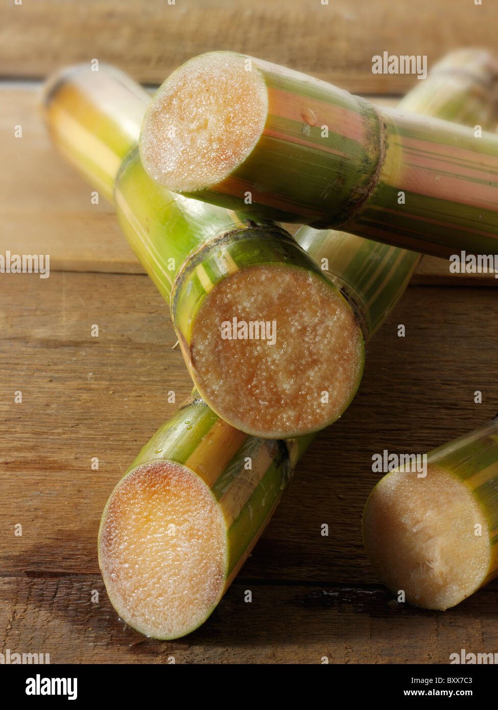 Sticks of raw sugar cane cut to show the inside Stock Photo Alamy