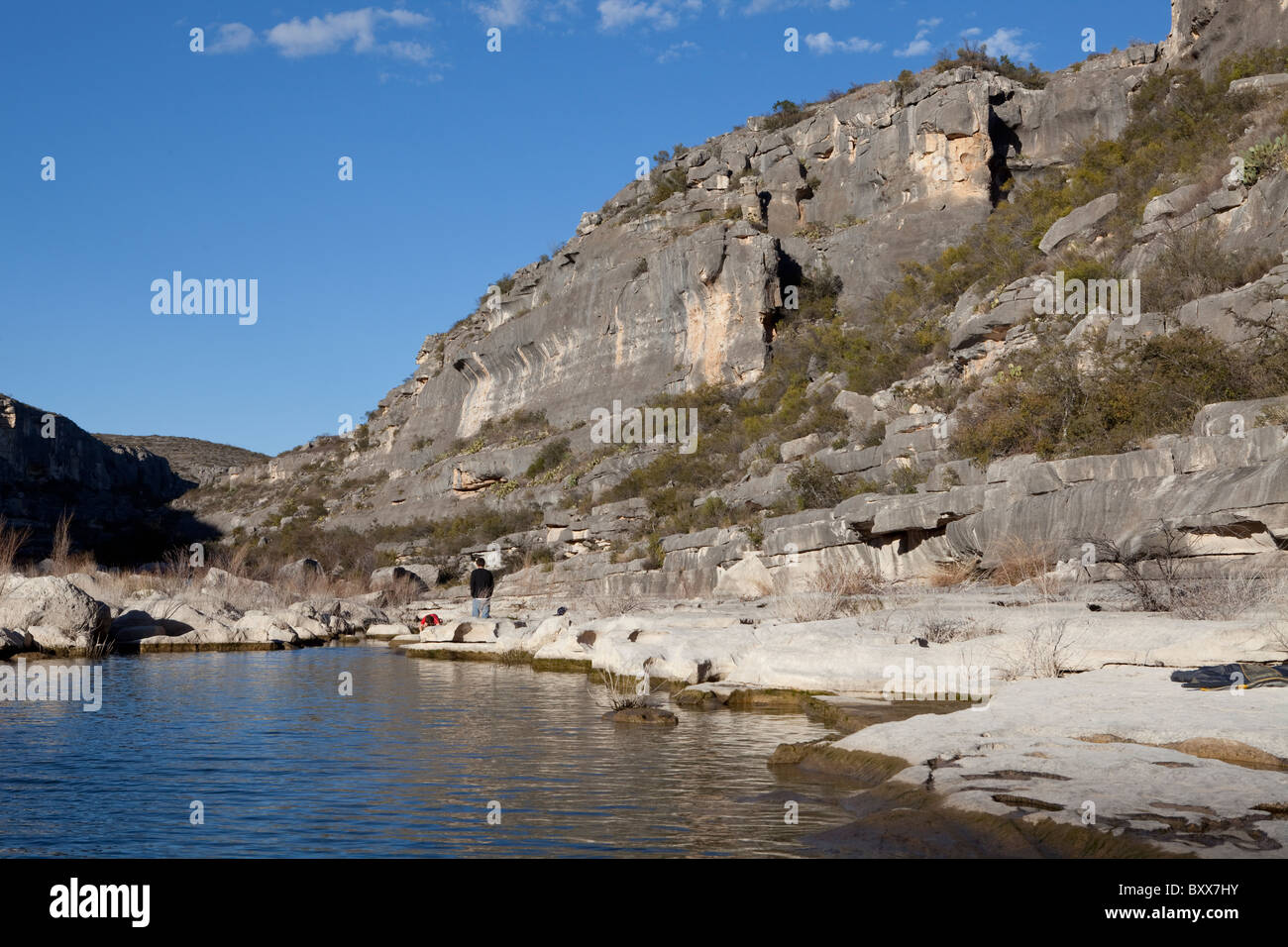 Limestone cliffs tower above the Pecos River arm of Lake Amistad