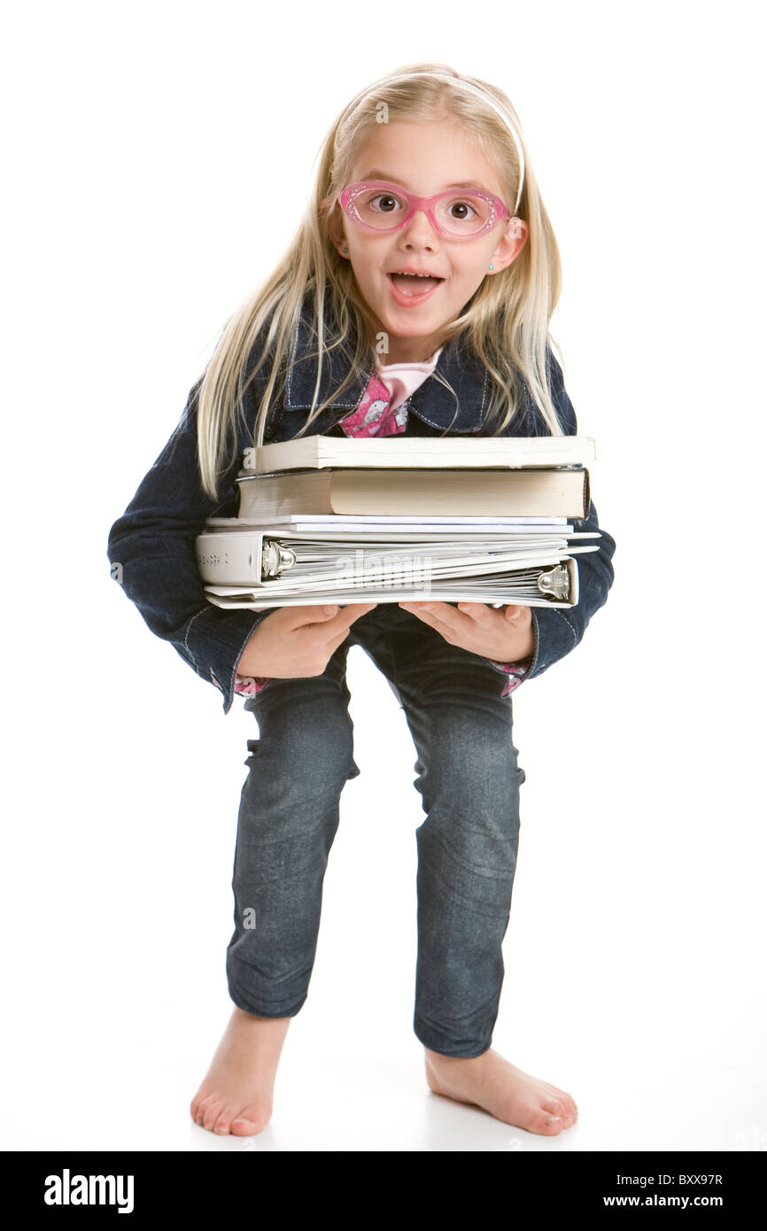 Cute little girl holding books Stock Photo - Alamy