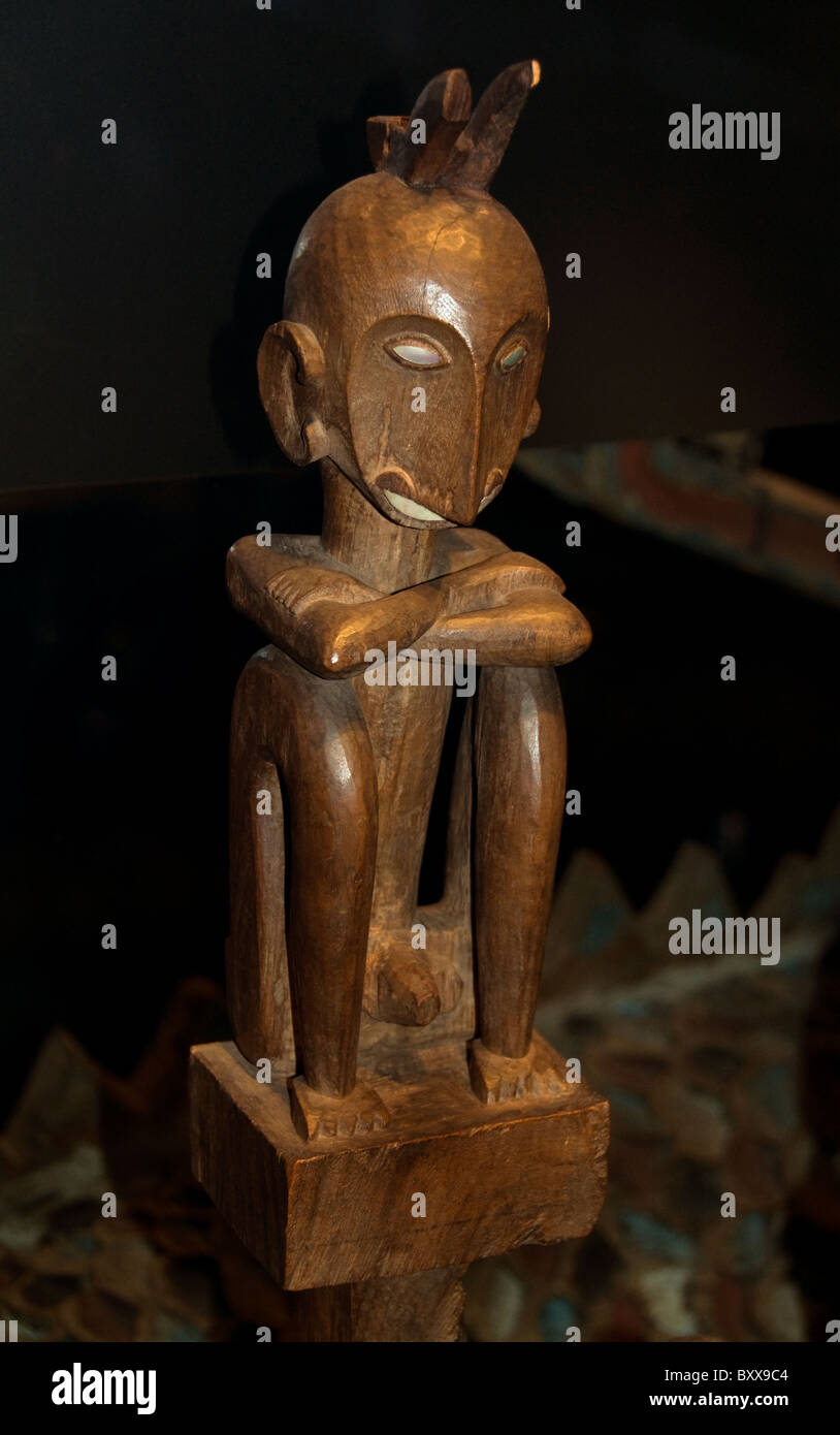 sculpture statue grandpa on a chair 1930 Southeast Maluku Moluccas Indonesia Indonesian Stock Photo