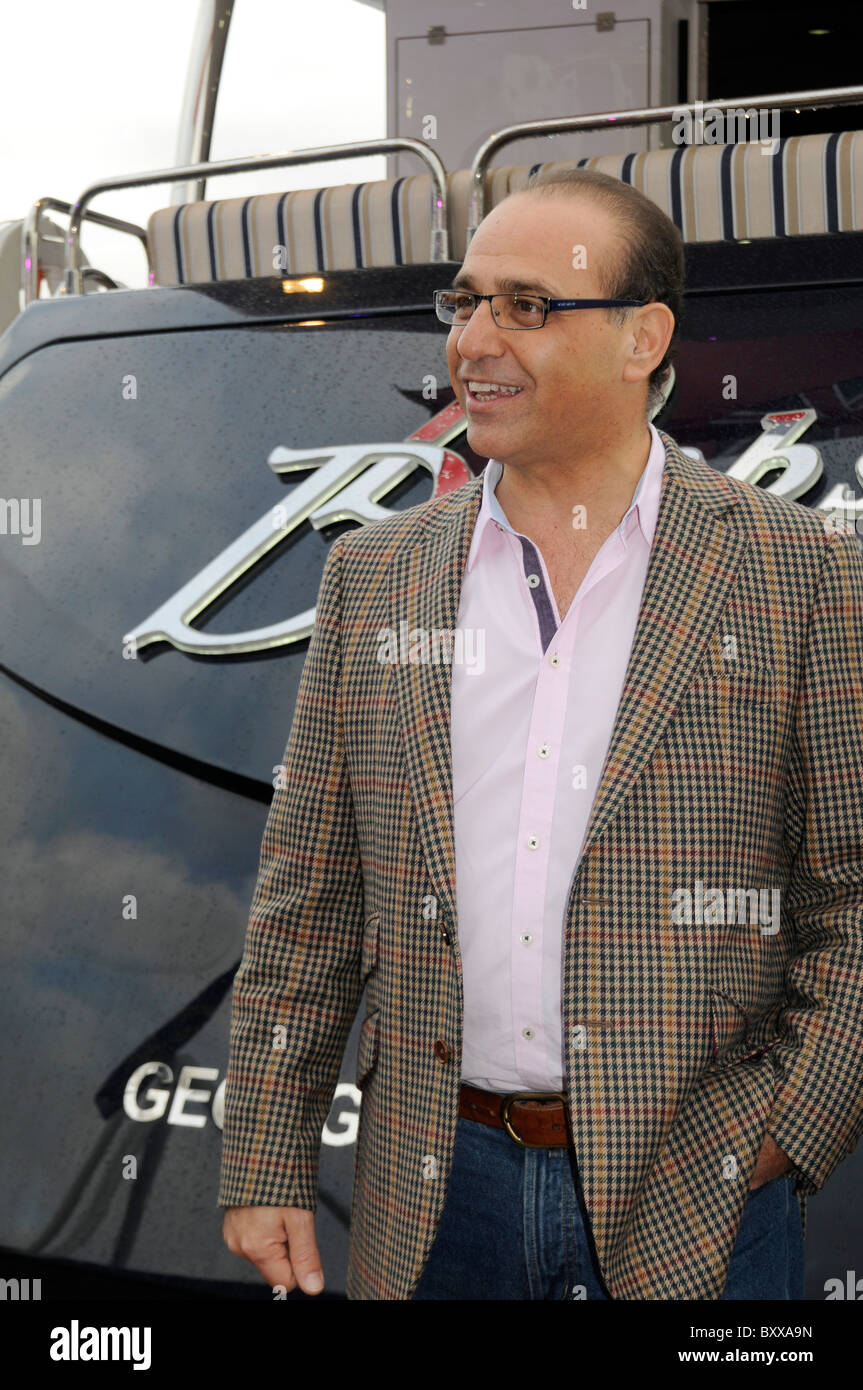 Billionaire tycoon Theo Paphitis member of the Dragon's Den team by his new yacht at the London Boat show, UK Stock Photo