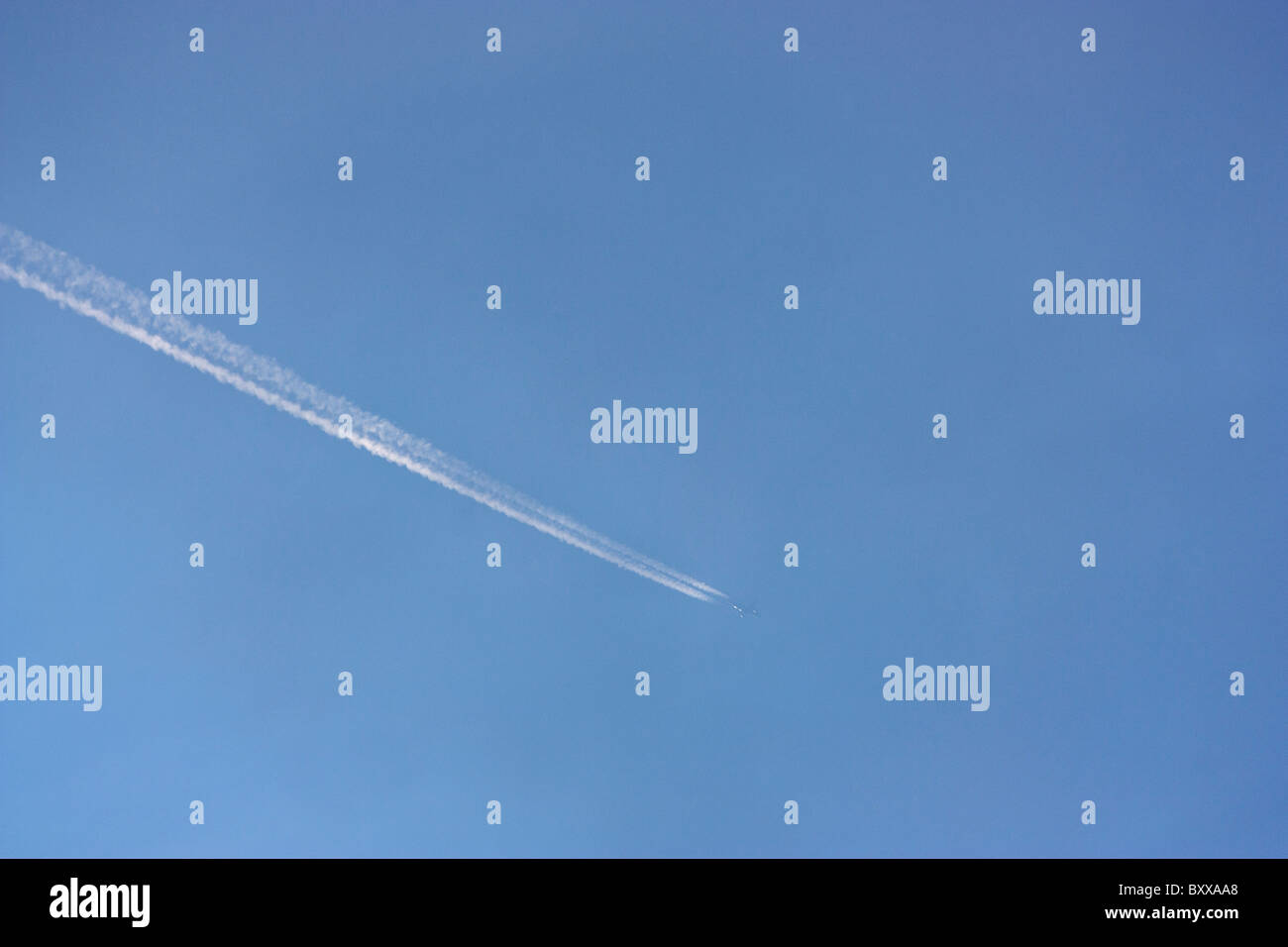 Jet and vapour trails Stock Photo