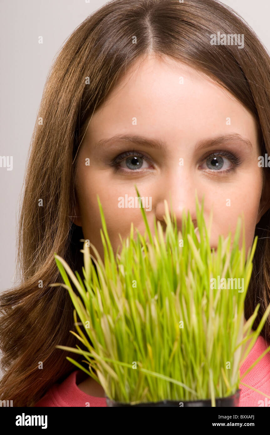 Woman holding a plant Stock Photo - Alamy