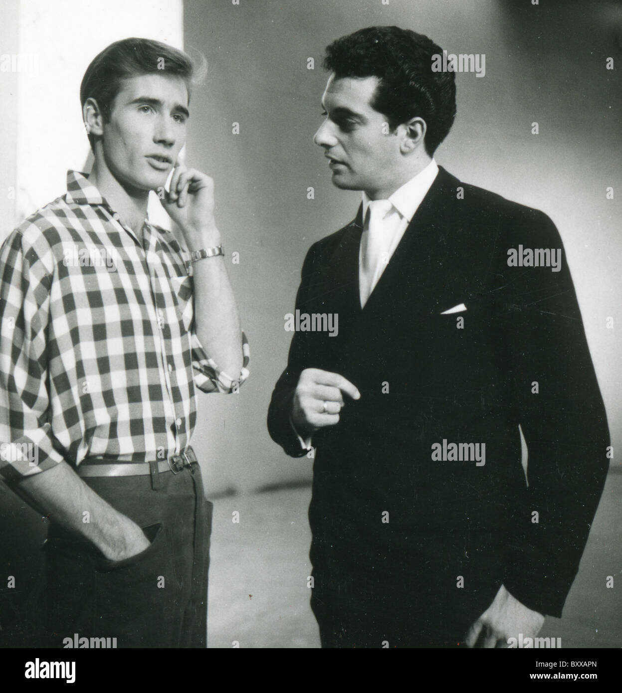 JIM DALE at left chats with fellow singer Frankie Vaughan on TV's Six Five Special in 1957 Stock Photo