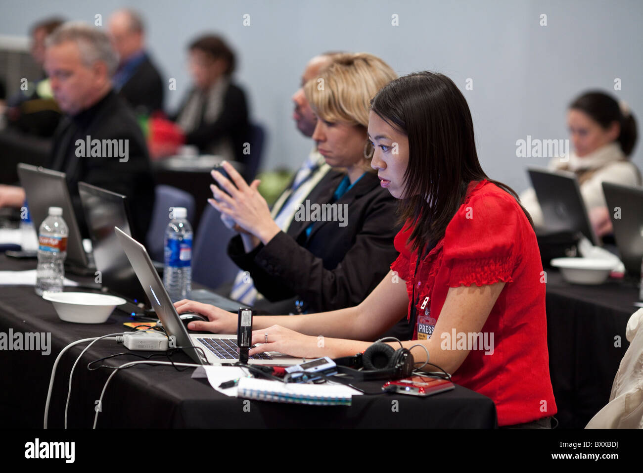 Journalists on press row cover a televised debate between candidates for governor of Texas at the University of North Texas Stock Photo