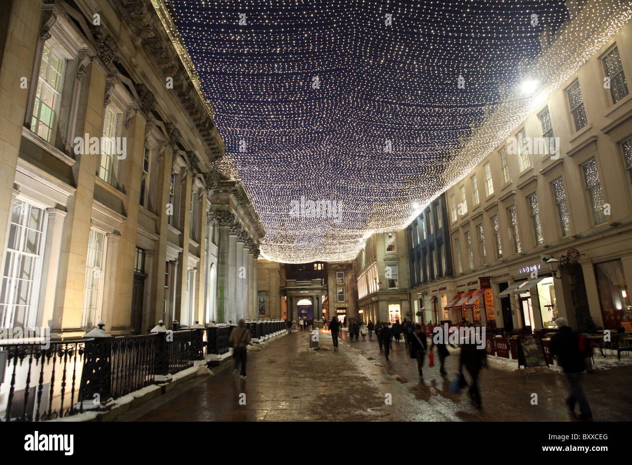 Royal Exchange Square lit by Christmas lights during the night in Glasgow, Scotland, UK Stock Photo
