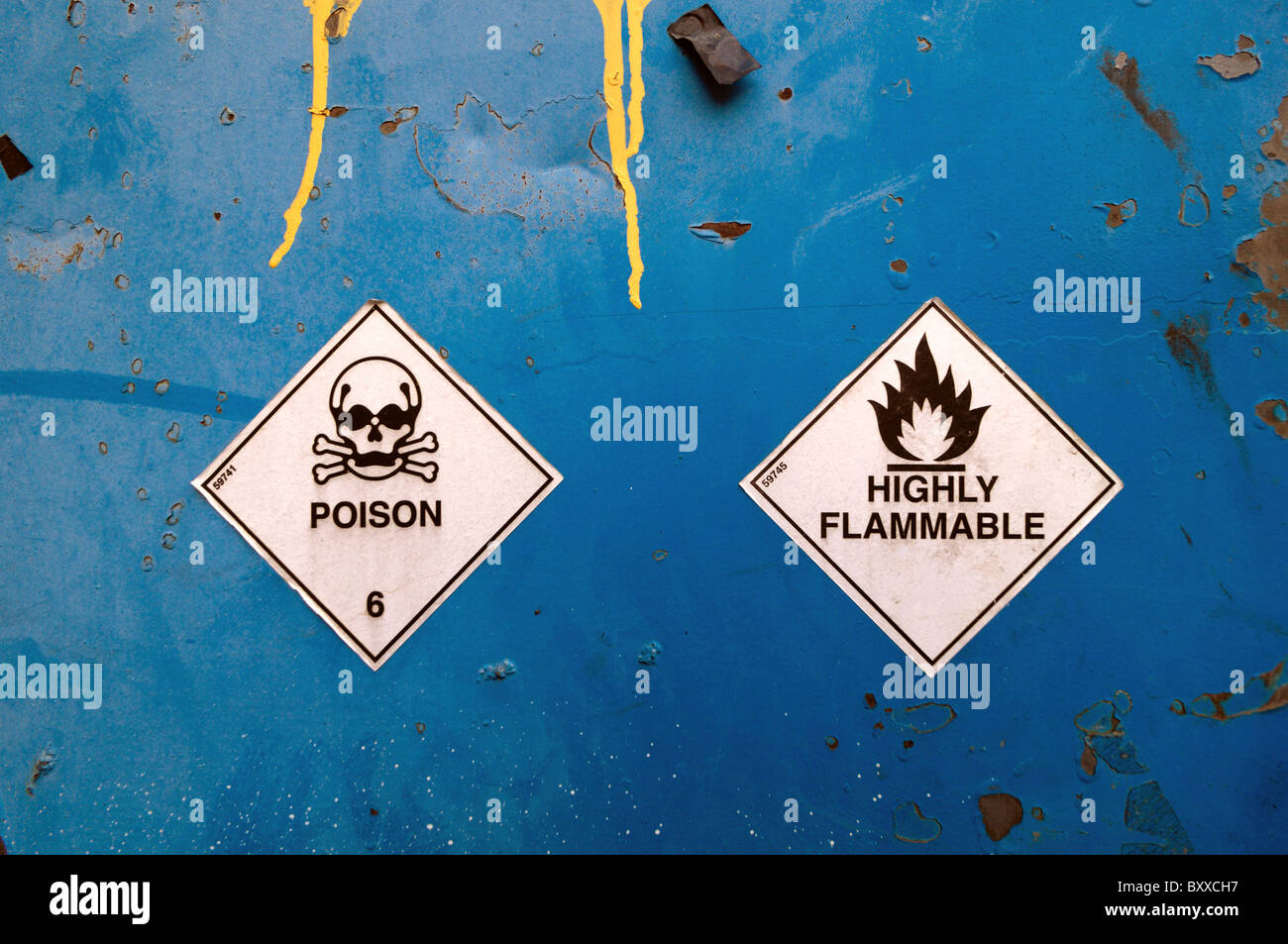Blue rusting surface with warning signs attached. Stock Photo