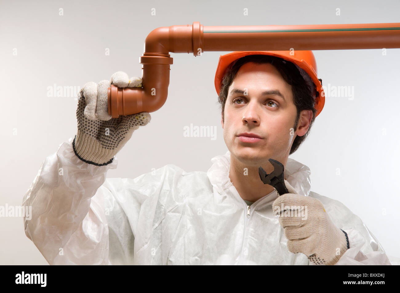 plumber using wrench on pipe Stock Photo Alamy