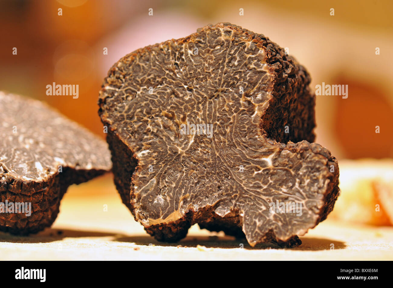 black truffles (tuber melanosporum) on a table Stock Photo