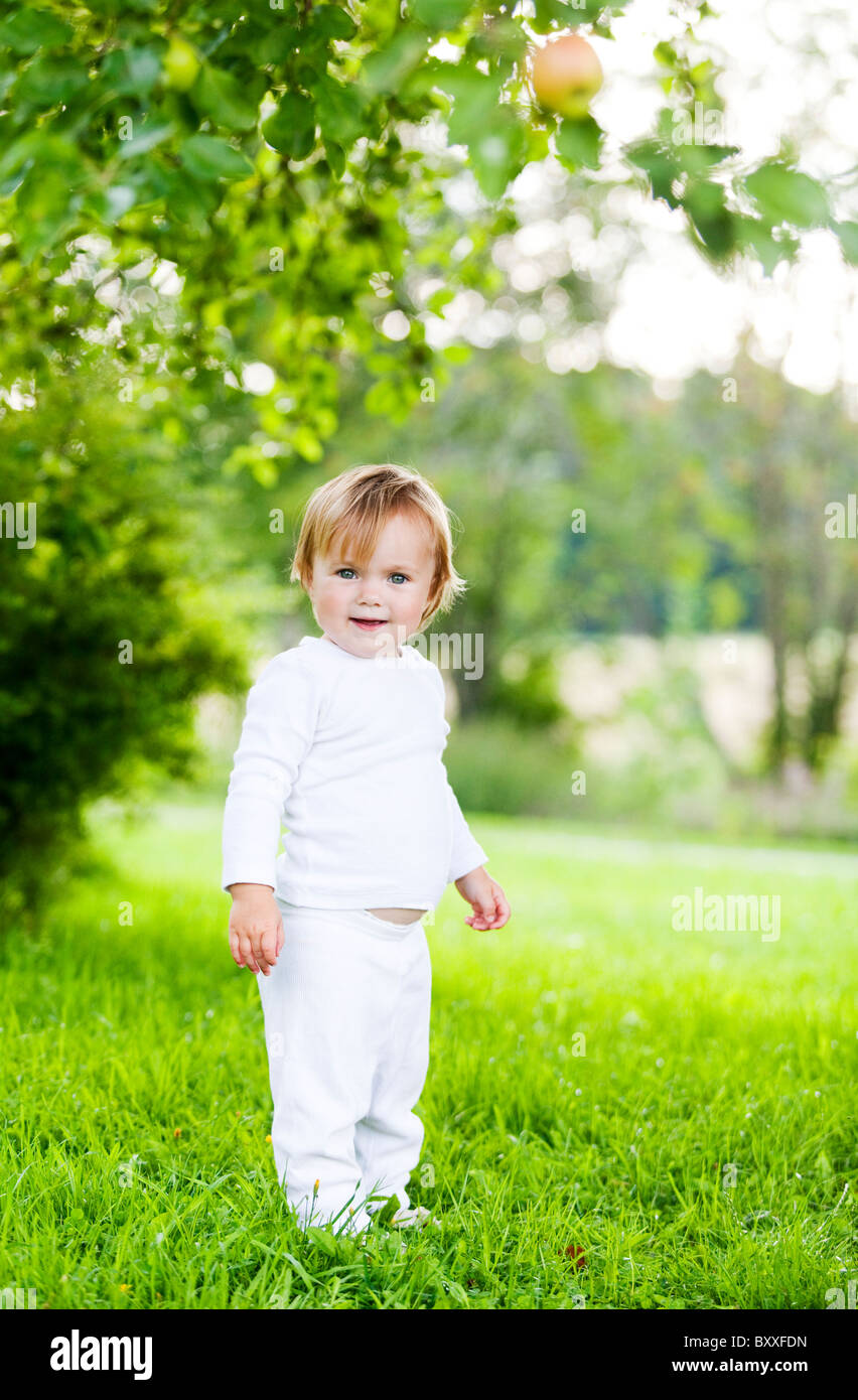 Little girl looking at camer with a smile.Nashulta,Sweden Stock Photo