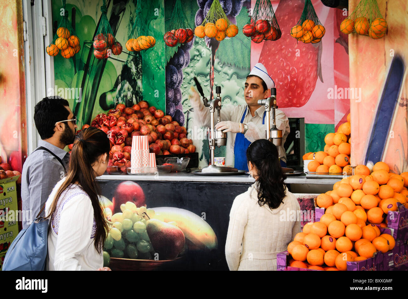 old metal fruit vegetable juice press squeeze machine street vendor with  fruit photographed in Istanbul Turkey Sultanahmet Stock Photo - Alamy