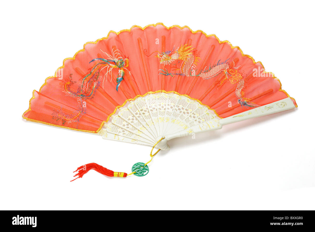 Open red Chinese folding fan with dragon and pheonix design on white background Stock Photo