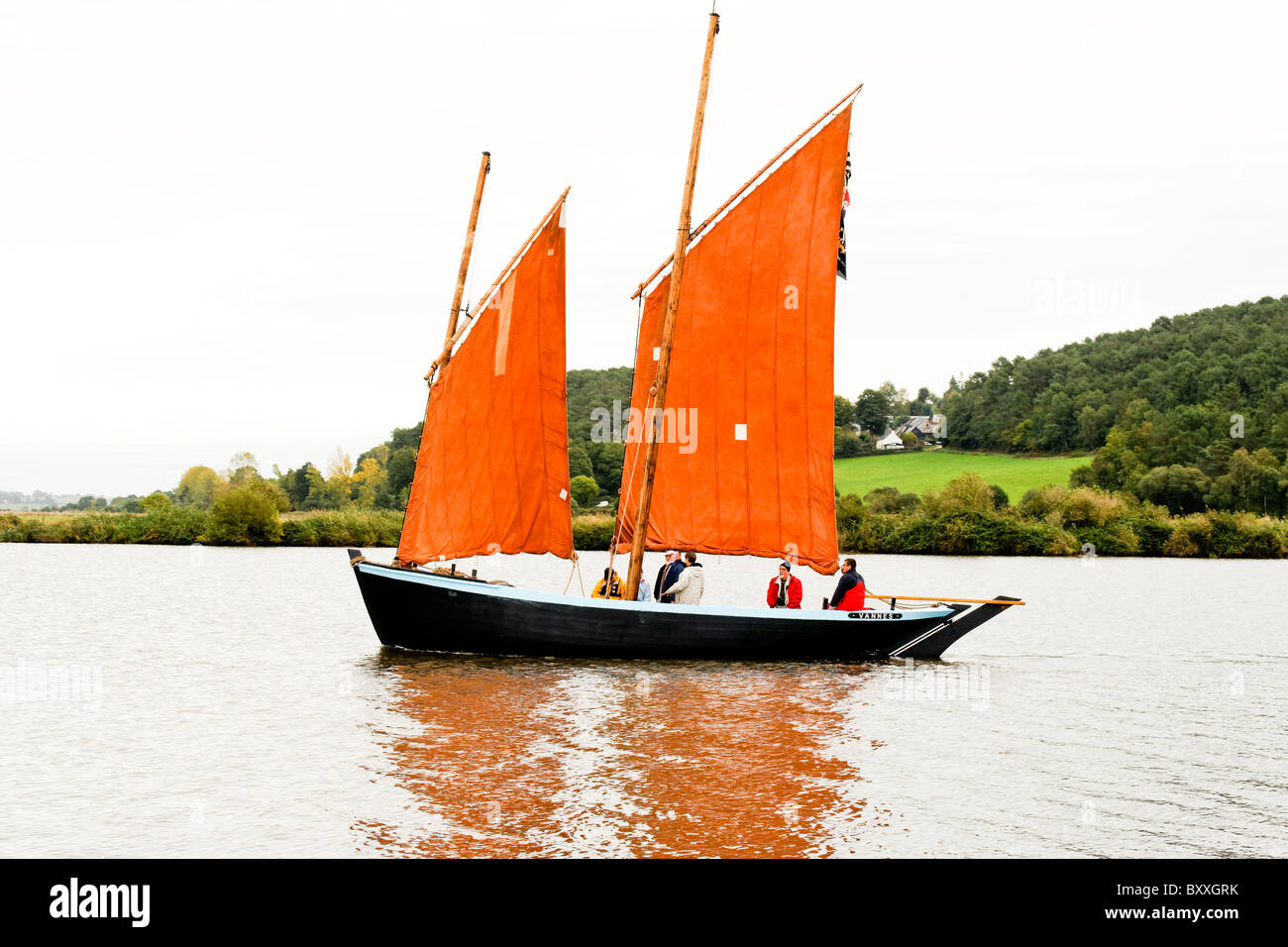 Traditional gaff rigged boat on The River Vilaine, Brittany on its way to the chestnut festival Stock Photo