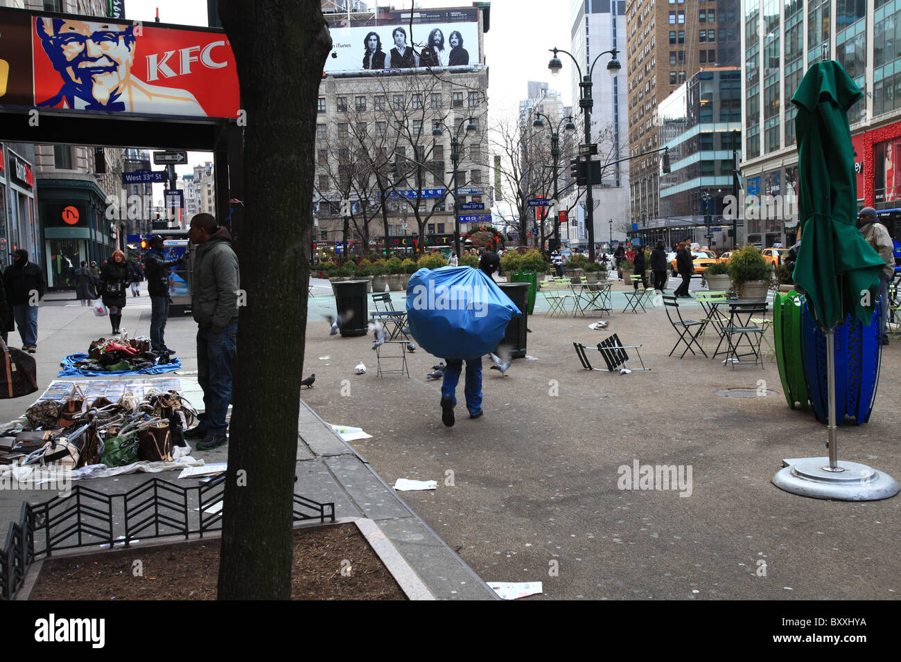 Counterfeit fake designer handbags on sale on sidewalk in New York city