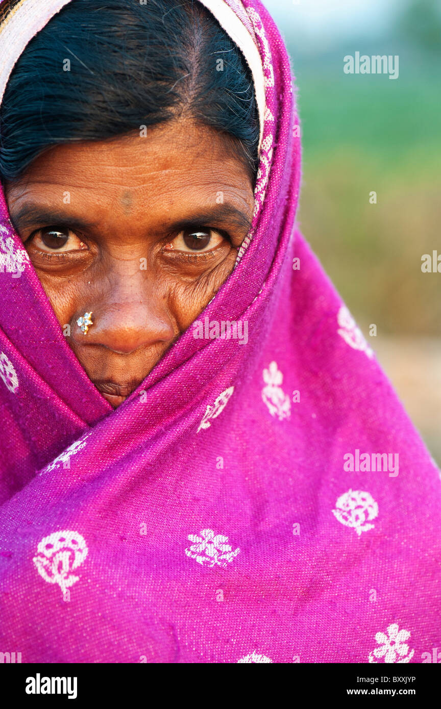 Indian woman wrapped in a pink shawl, keeping warm in winter. Andhra Pradesh, India Stock Photo