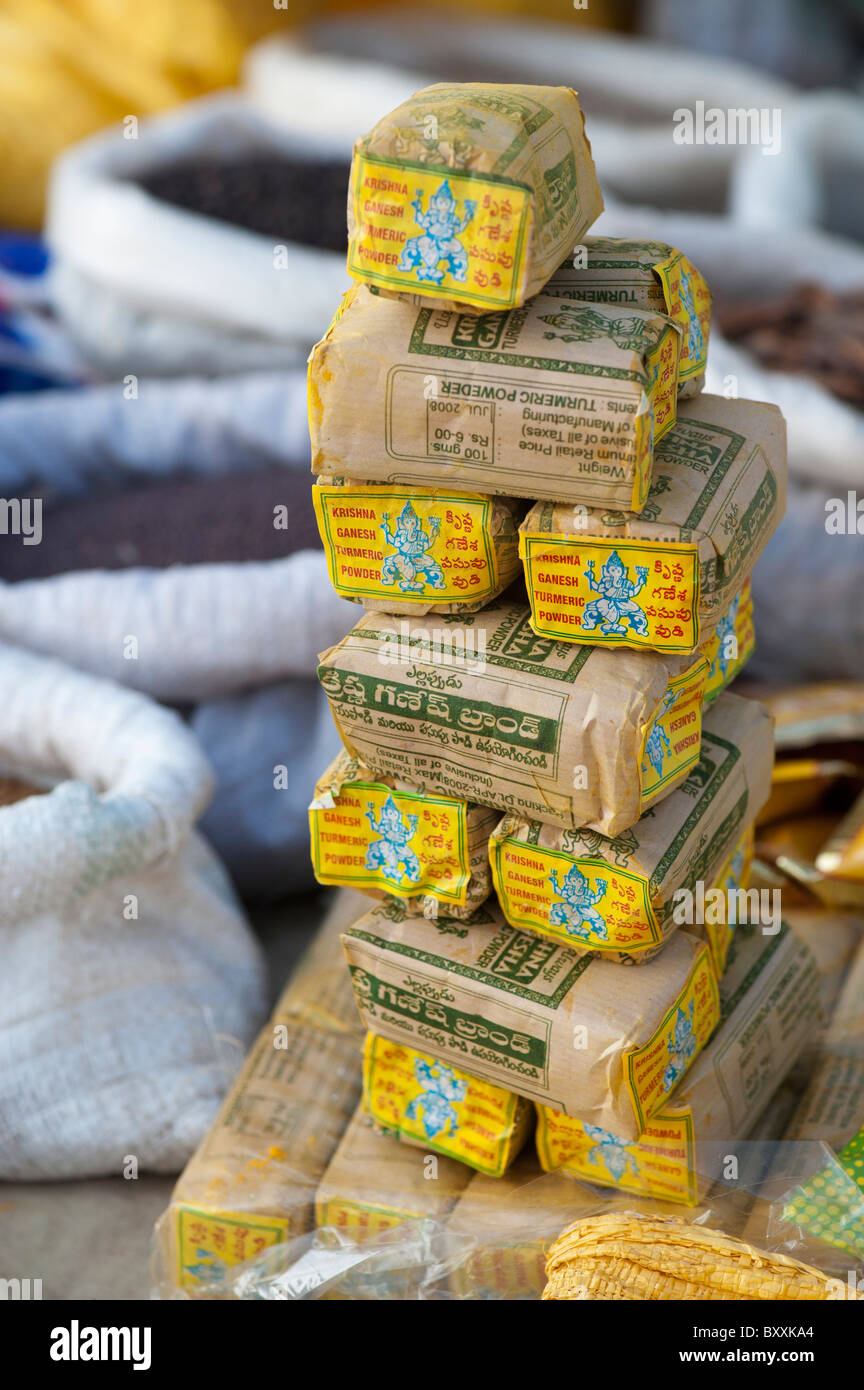 indian market stall with packets of indian turmeric spices and dried