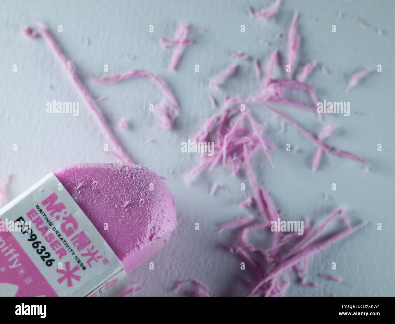 A macro shot of a pink eraser rubber set against white background Stock Photo