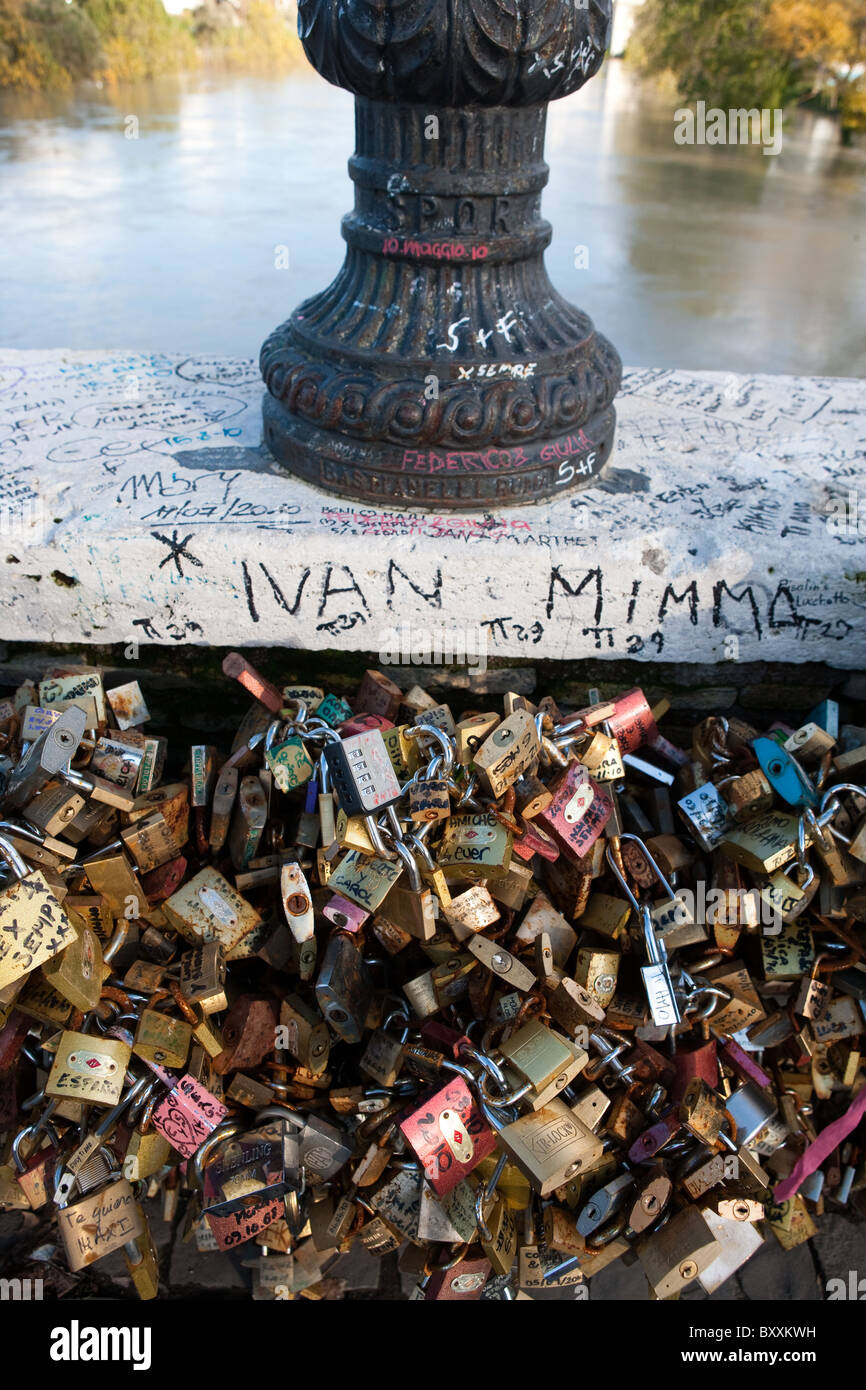 First love lock locks on the Milvio bridge chained to wall Rome Italy
