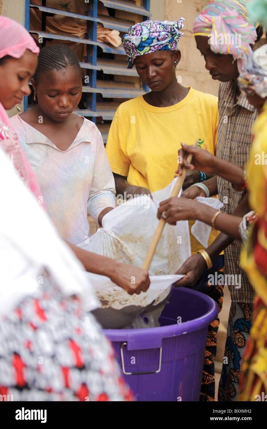 In Ouagadougou, Burkina Faso, Fulani women work together to make a