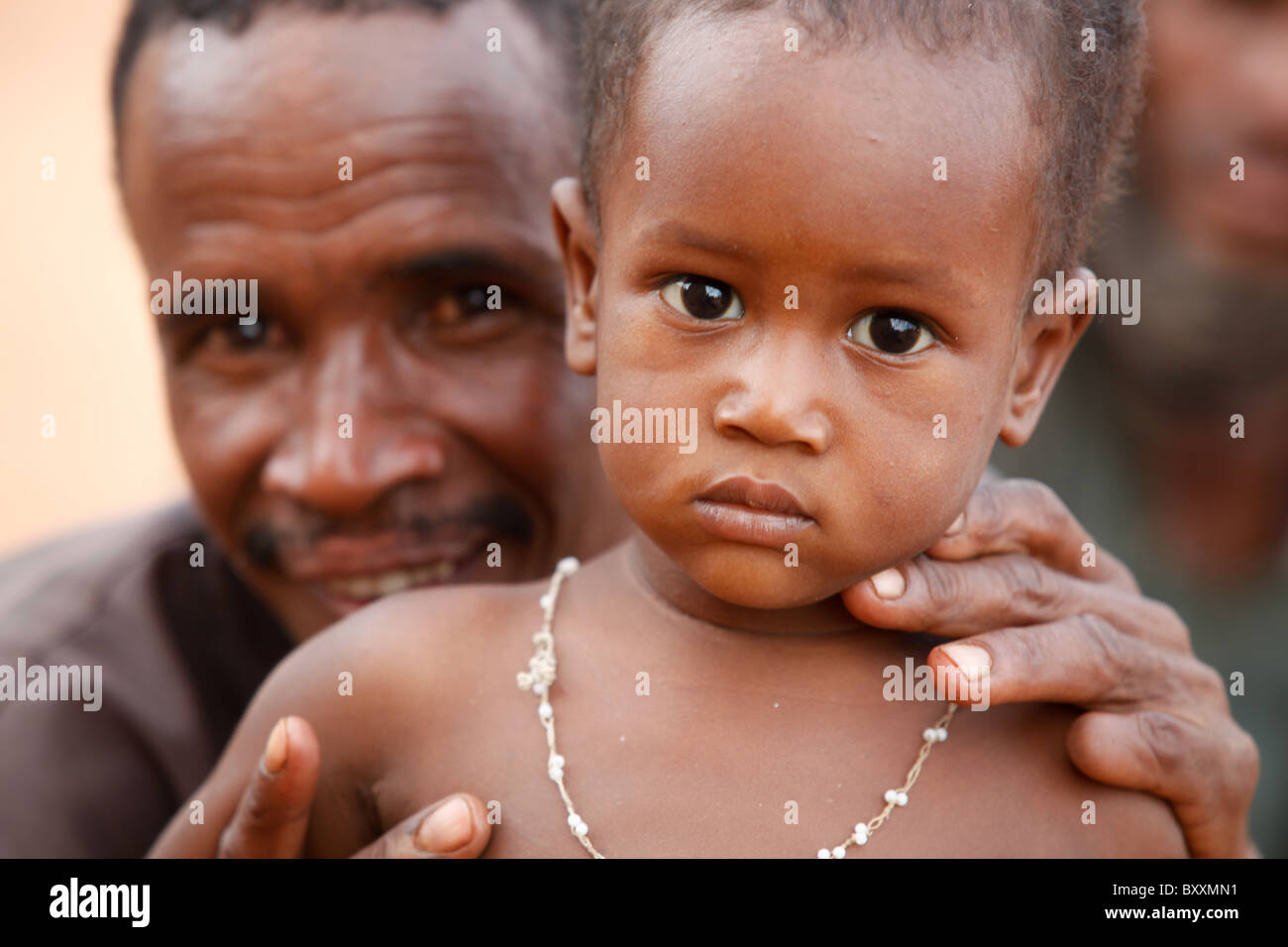 A Fulani man holds his son at theirr home in Djibo in northern Burkina Faso, West Africa. Stock Photo