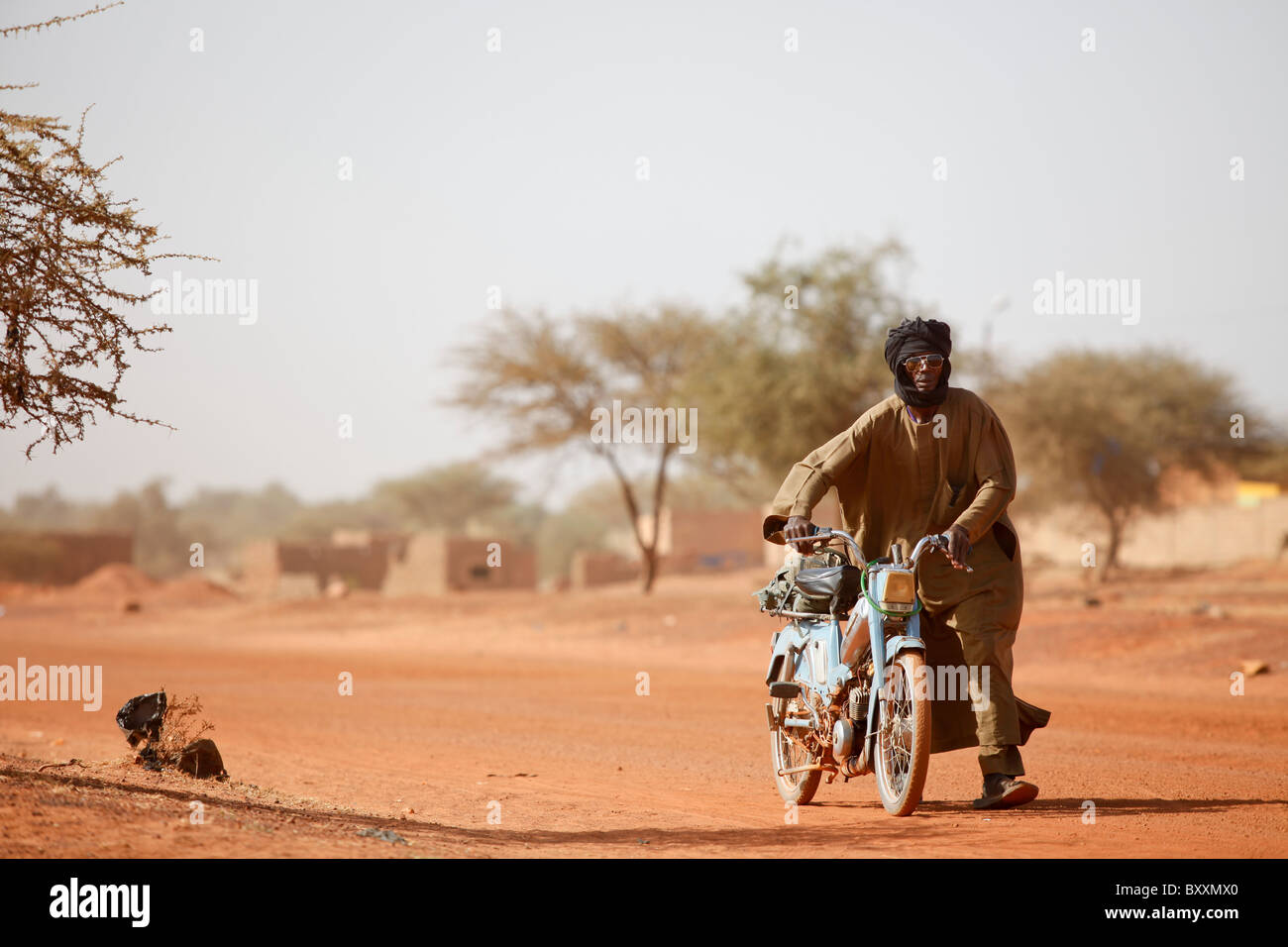 Mopeds are increasing rapidly as a form of transport throughout the region.  Djibo, Burkina Faso. Stock Photo