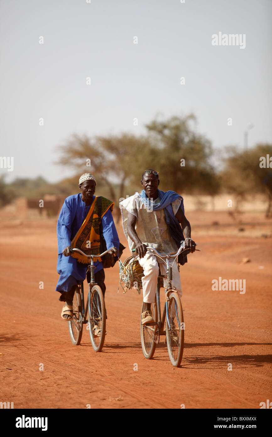In Djibo, Burkina Faso, mopeds grow in popularity, but the bicycle still remains the most common form of transport after walking Stock Photo