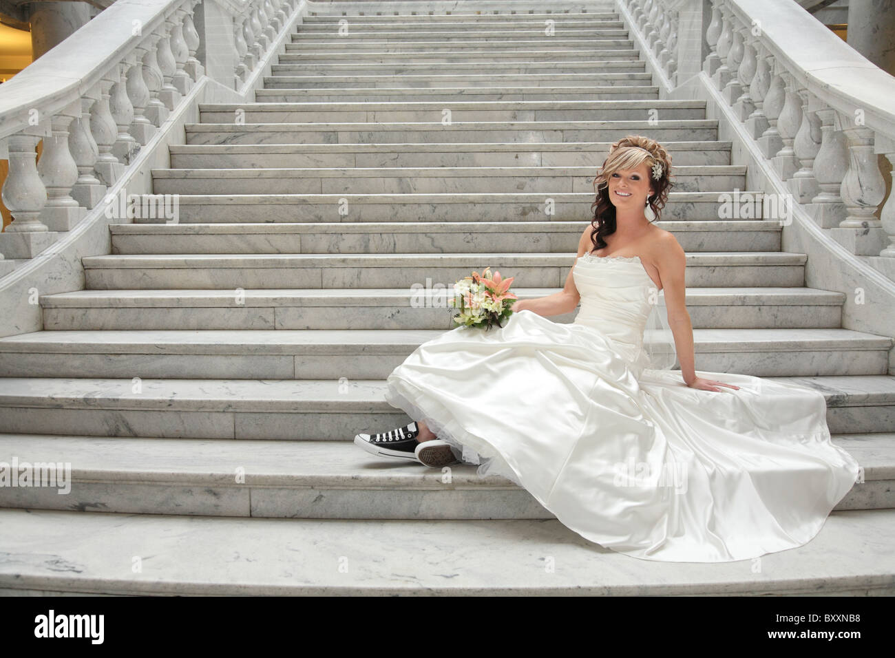 Bride alone on stairs hi-res stock photography and images - Alamy