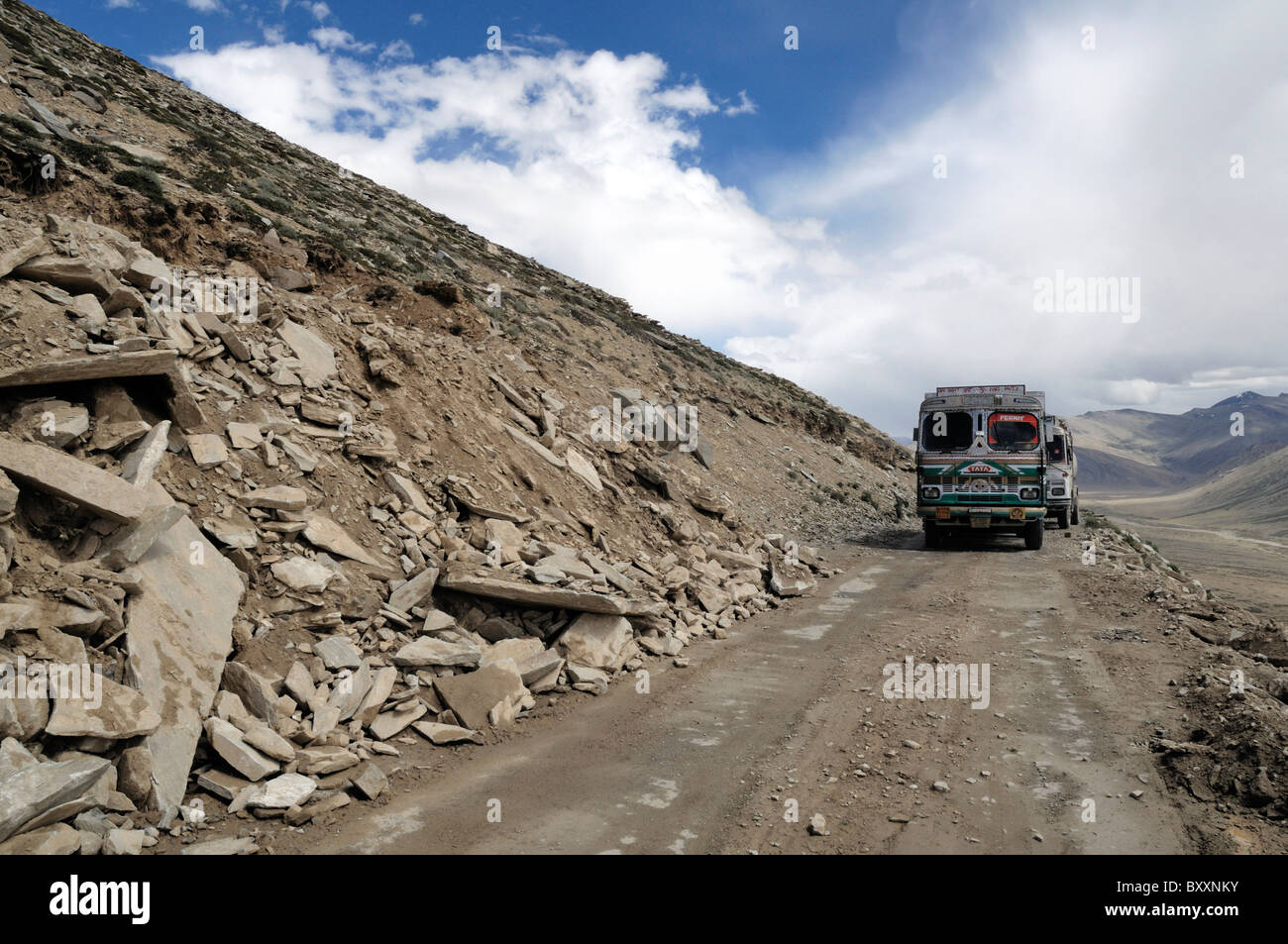 Two TATA trucks on the 'Himalaya Highway'. These trucks are used to transport goods to the outer regions of the Himalaya. Stock Photo