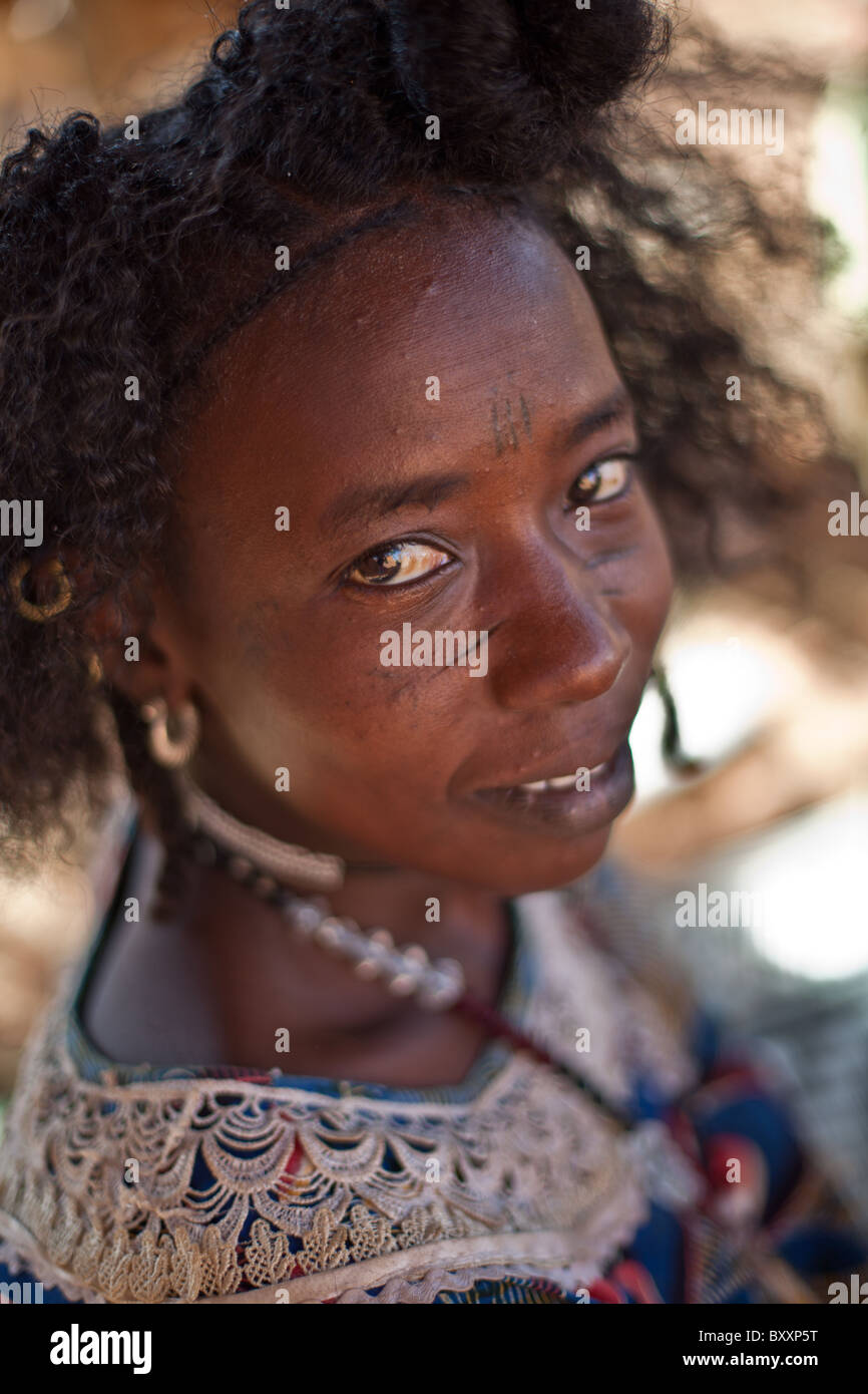 Fulani woman in Djibo in northern Burkina Faso. The woman sports the traditional facial scarring, that is considered beautiful. Stock Photo