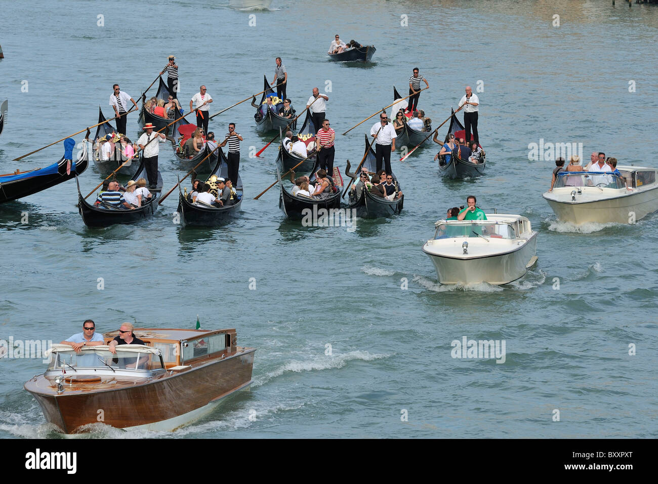Venice. Italy. Groups of tourists in gondolas on the Grand Canal. Stock Photo